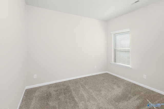 empty room featuring carpet flooring