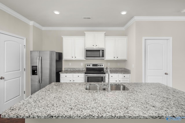 kitchen featuring a center island with sink, white cabinetry, sink, and appliances with stainless steel finishes