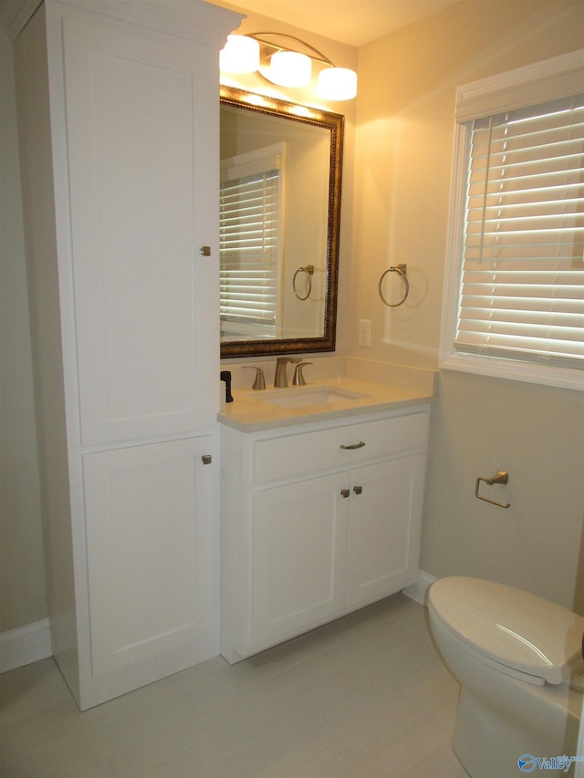 bathroom featuring vanity and toilet