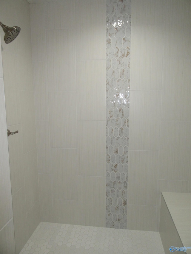 bathroom with a tile shower