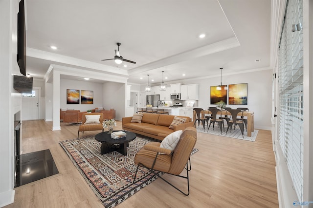 21837 Natures Cove Dr, Athens, AL 35613 - living room featuring ceiling fan, light wood-type flooring, baseboards, ornamental molding, and recessed lighting