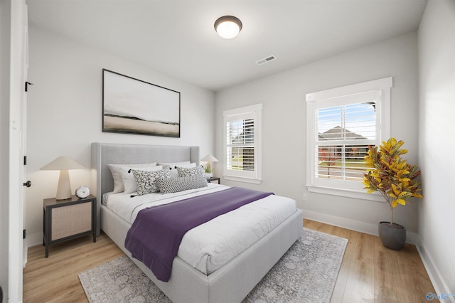 21837 Natures Cove Dr, Athens, AL 35613 - bedroom featuring light wood-type flooring and baseboards