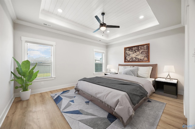 21837 Natures Cove Dr, Athens, AL 35613 - bedroom featuring a raised ceiling, light wood finished floors, crown molding, baseboards, and recessed lighting