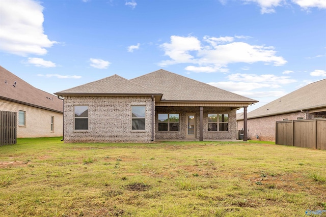 21837 Natures Cove Dr, Athens, AL 35613 - back of property with brick siding, roof with shingles, and central AC
