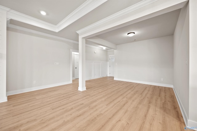 unfurnished living room with light hardwood / wood-style floors and ornamental molding