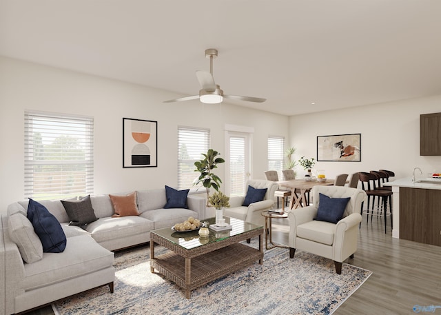 living room with ceiling fan, wood-type flooring, and sink