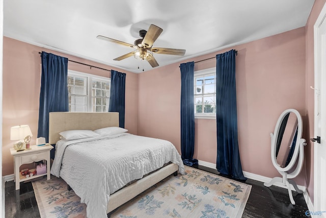 bedroom featuring ceiling fan and dark hardwood / wood-style flooring