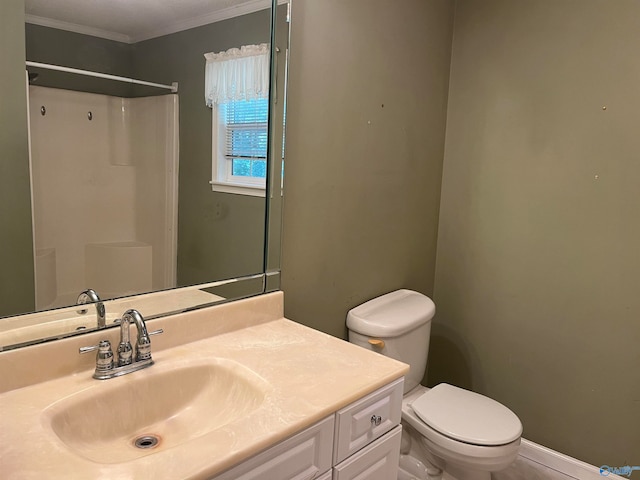 bathroom with ornamental molding, vanity, toilet, and a shower