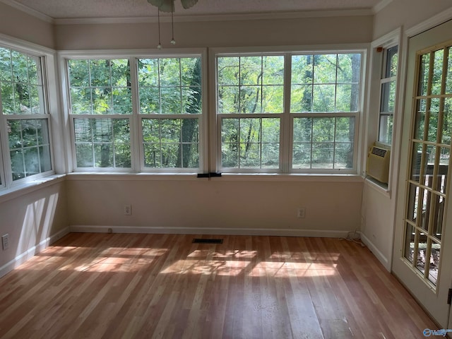 unfurnished sunroom featuring plenty of natural light