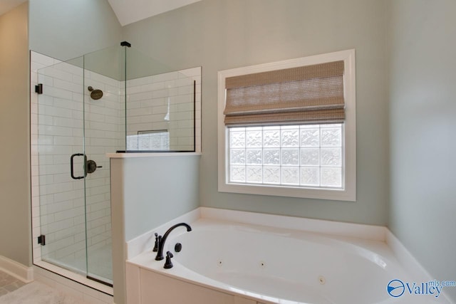 bathroom with shower with separate bathtub