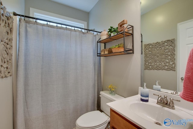 bathroom with vanity and toilet