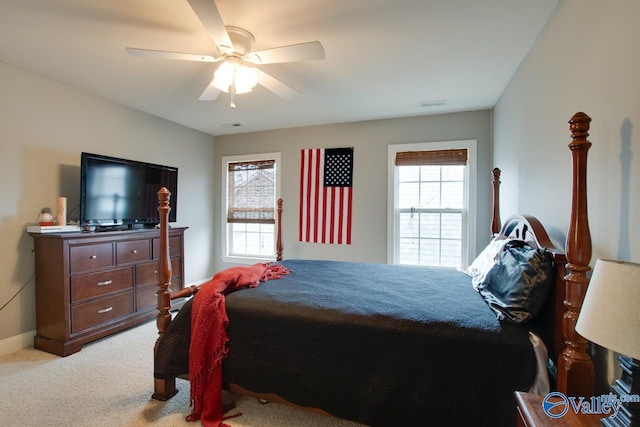 bedroom with light carpet and ceiling fan