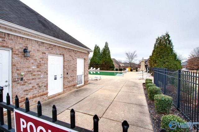 view of patio featuring a community pool