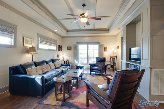 living room with dark hardwood / wood-style flooring, ornamental molding, a raised ceiling, and ceiling fan