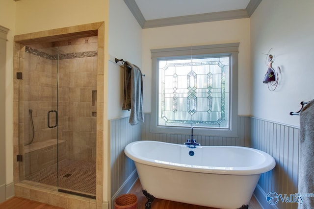 bathroom featuring ornamental molding and independent shower and bath