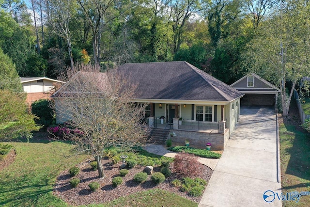 view of front of house featuring a carport and covered porch