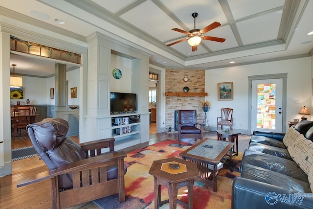 living room featuring crown molding, a healthy amount of sunlight, hardwood / wood-style floors, and ceiling fan