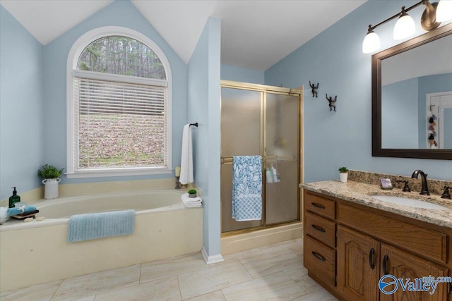 bathroom with a healthy amount of sunlight, vaulted ceiling, and plus walk in shower