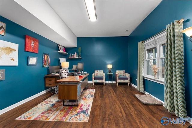 home office with dark hardwood / wood-style flooring