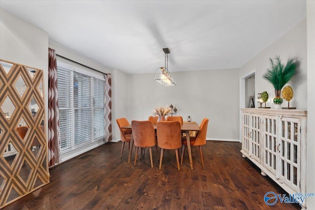 dining space featuring a healthy amount of sunlight and dark hardwood / wood-style flooring