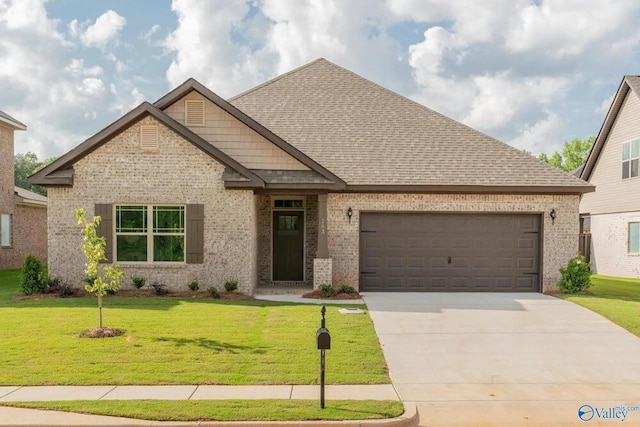 craftsman house with a garage and a front yard