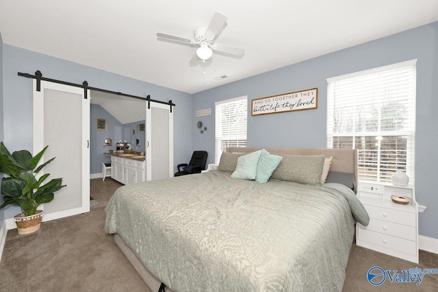 899 Pine Grove Rd, Harvest, AL 35749 - bedroom featuring dark colored carpet, multiple windows, baseboards, and a barn door