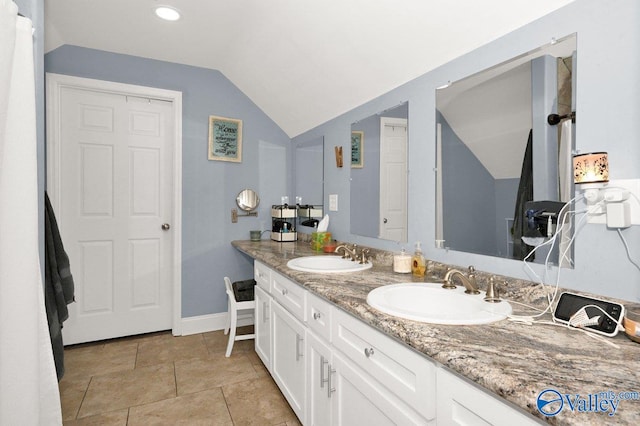 899 Pine Grove Rd, Harvest, AL 35749 - full bath featuring vaulted ceiling, double vanity, a sink, and baseboards
