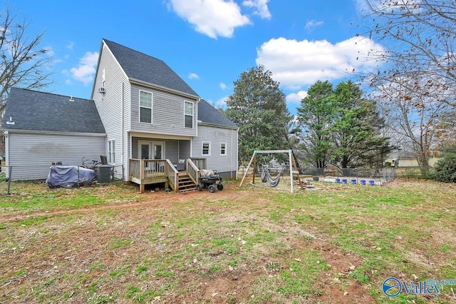 899 Pine Grove Rd, Harvest, AL 35749 - rear view of property with a shingled roof, a wooden deck, a lawn, fence, and french doors