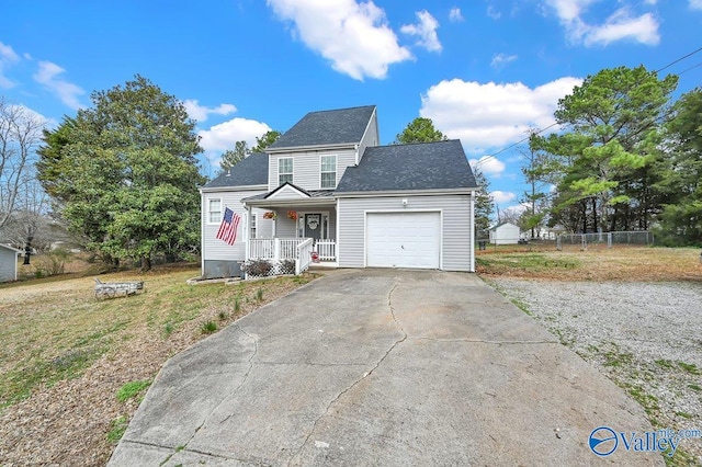 899 Pine Grove Rd, Harvest, AL 35749 - view of front facade with concrete driveway, roof with shingles, an attached garage, covered porch, and fence