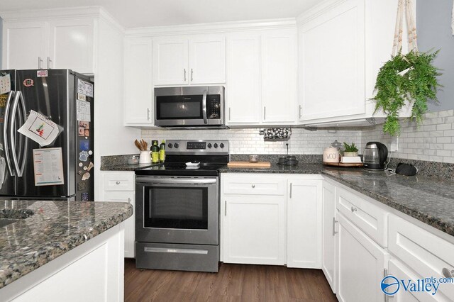 899 Pine Grove Rd, Harvest, AL 35749 - kitchen with dark stone counters, stainless steel appliances, and white cabinetry