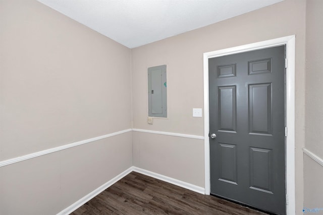 1007 Honeysuckle Ln SW, Decatur, AL 35601 - foyer featuring electric panel, dark wood-style flooring, and baseboards