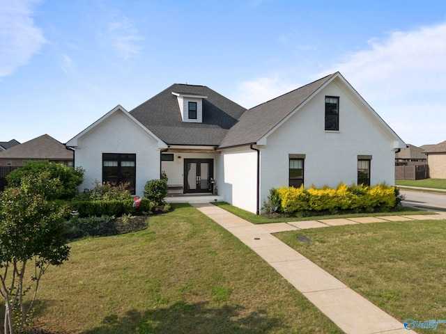 24673 Beacon Cir, Athens, AL 35613 - modern farmhouse with french doors, brick siding, a front yard, and roof with shingles