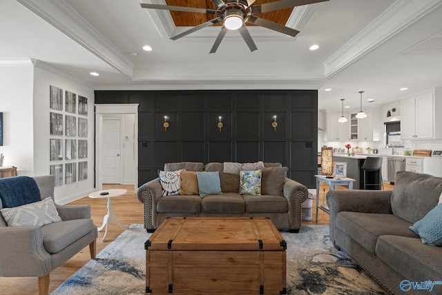 24673 Beacon Cir, Athens, AL 35613 - living room with ornamental molding, a raised ceiling, a ceiling fan, light wood-style floors, and recessed lighting