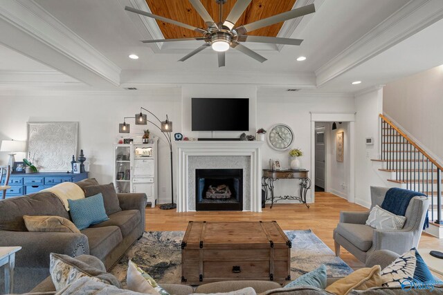 24673 Beacon Cir, Athens, AL 35613 - living room with a ceiling fan, wood finished floors, ornamental molding, stairway, and a fireplace