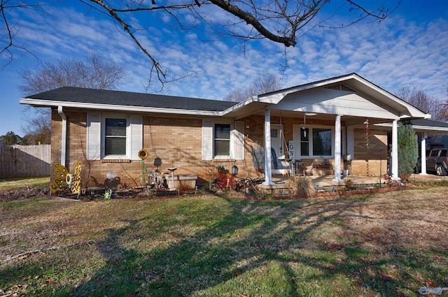 view of front facade with a front yard and a porch