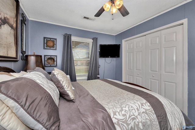 bedroom featuring ceiling fan, a closet, and crown molding