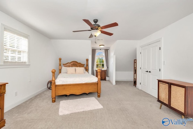 bedroom with light carpet and ceiling fan