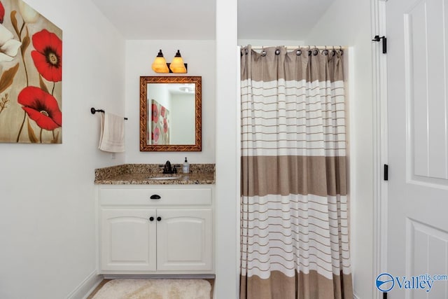 bathroom with vanity and a shower with shower curtain