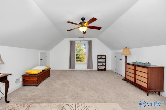 additional living space with ceiling fan, vaulted ceiling, and light colored carpet