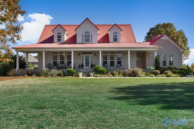 country-style home with a front yard and covered porch