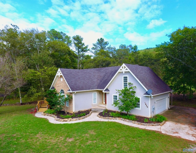 view of front of house with a garage and a front yard