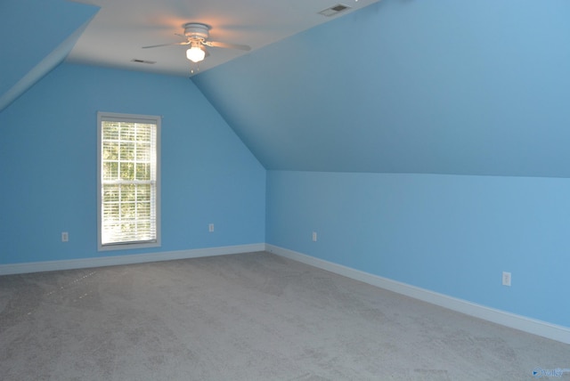 bonus room featuring ceiling fan, lofted ceiling, and carpet flooring