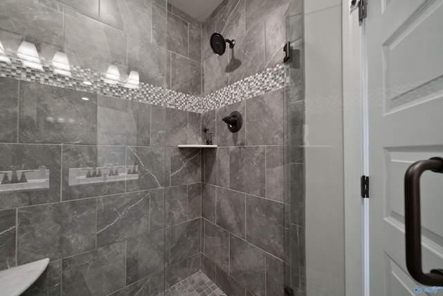 bathroom with a shower with door