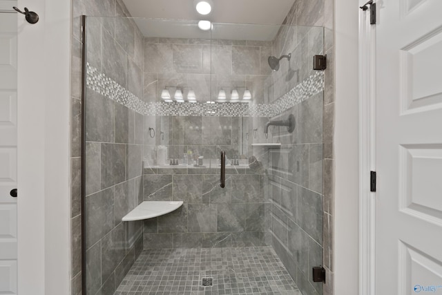 bathroom with a shower with shower door