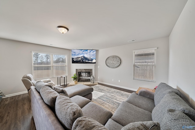 living room featuring a fireplace and hardwood / wood-style flooring