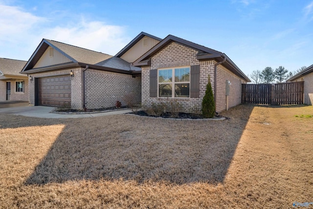 view of front of property featuring a front lawn and a garage