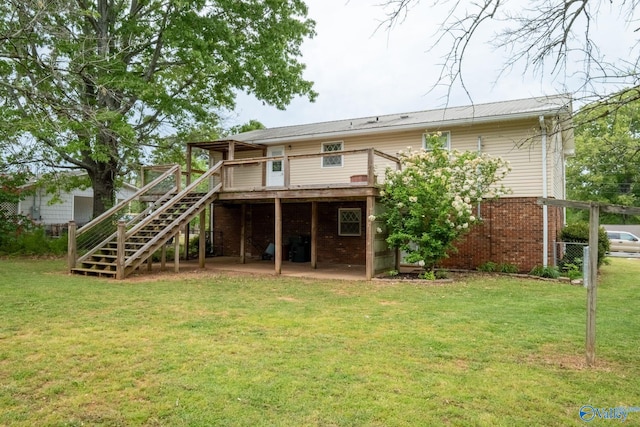 222 Lakewood Dr, Scottsboro, AL 35769 - rear view of property featuring a wooden deck, brick siding, a yard, and stairs