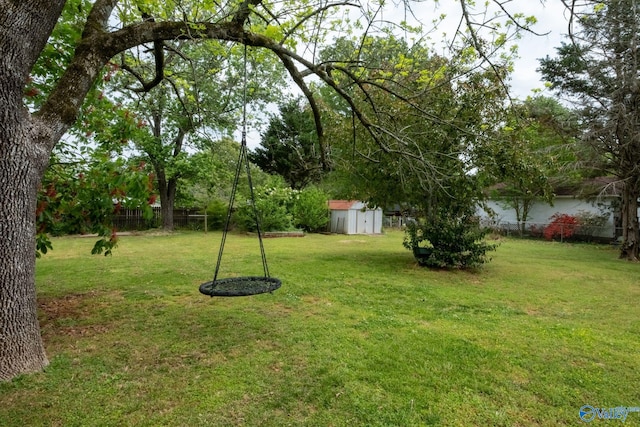 222 Lakewood Dr, Scottsboro, AL 35769 - view of yard with a fenced backyard, an outbuilding, and a storage unit