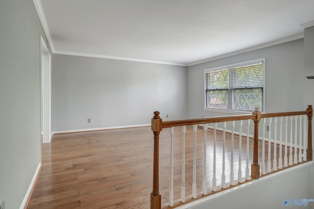 222 Lakewood Dr, Scottsboro, AL 35769 - interior space featuring wood finished floors, baseboards, ornamental molding, and an upstairs landing