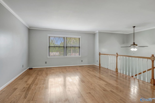 222 Lakewood Dr, Scottsboro, AL 35769 - spare room featuring wood-type flooring, baseboards, ornamental molding, and ceiling fan